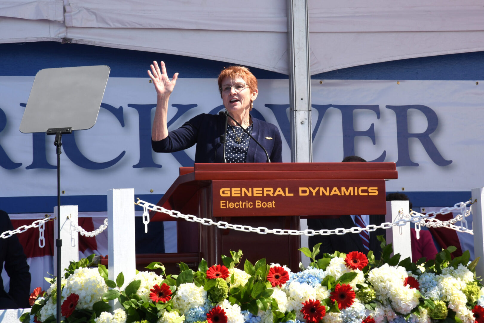 210731-N-GR655-164 GROTON, Conn. (July 31, 2021) – Darleen Greenert, sponsor of the pre-commissioning unit (PCU) Hyman G. Rickover (SSN 795), delivers remarks during a christening ceremony at General Dynamics Electric Boat shipyard facility in Groton, Conn., July 31, 2021. Rickover and crew will operate under Submarine Squadron (SUBRON) FOUR whose primary mission is to provide attack submarines that are ready, willing, and able to meet the unique challenges of undersea combat and deployed operations in unforgiving environments across the globe. (U.S. Navy photo by Chief Petty Officer Joshua Karsten/RELEASED)