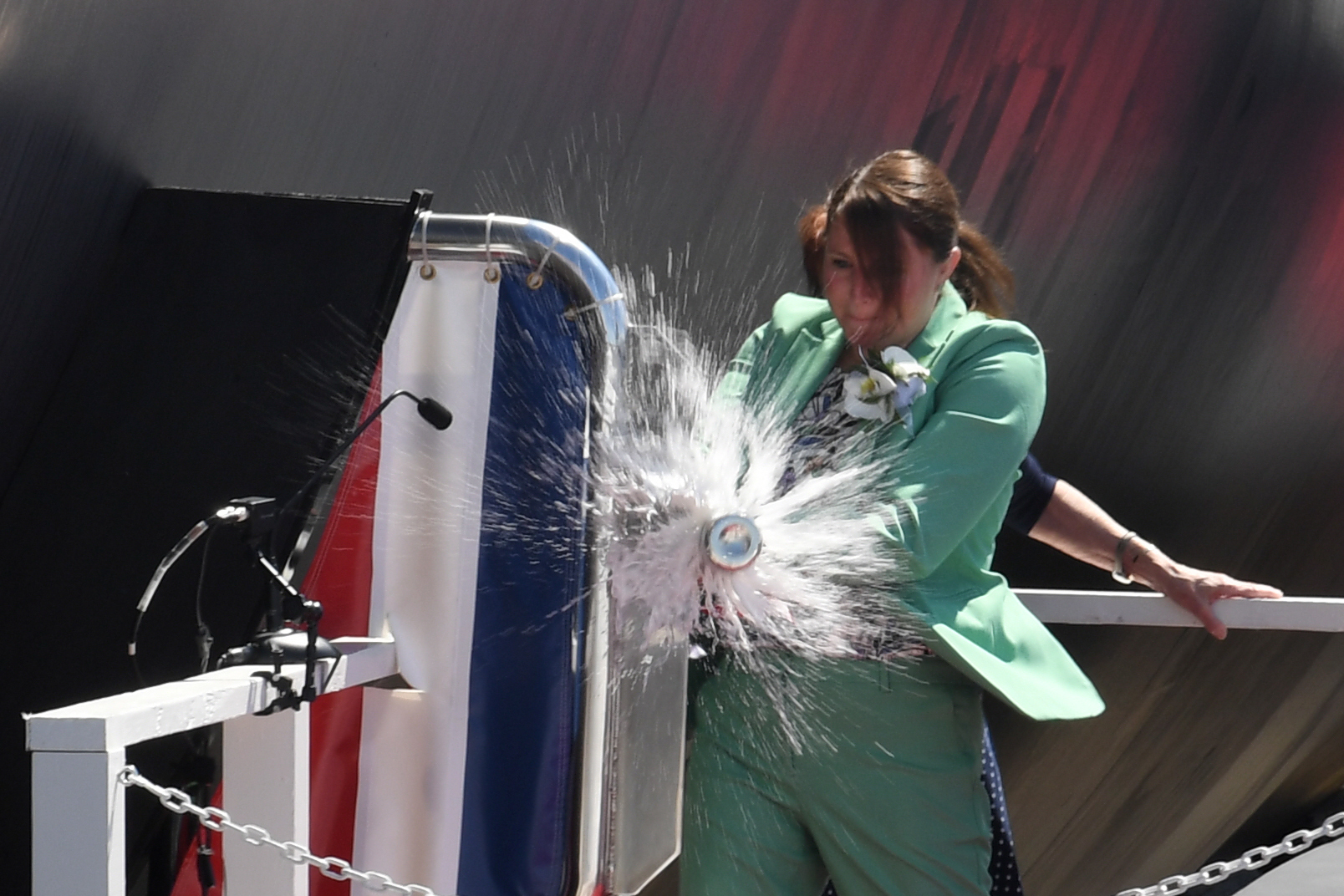 210731-N-GR655-298 GROTON, Conn. (July 31, 2021) – Sarah Greenert McNichol, Matron of Honor for the future USS Hyman G. Rickover (SSN 795), christens the ship during a ceremony at General Dynamics Electric Boat shipyard facility in Groton, Conn., July 31, 2021. Rickover and crew will operate under Submarine Squadron (SUBRON) FOUR whose primary mission is to provide attack submarines that are ready, willing, and able to meet the unique challenges of undersea combat and deployed operations in unforgiving environments across the globe. (U.S. Navy photo by Chief Petty Officer Joshua Karsten/RELEASED)